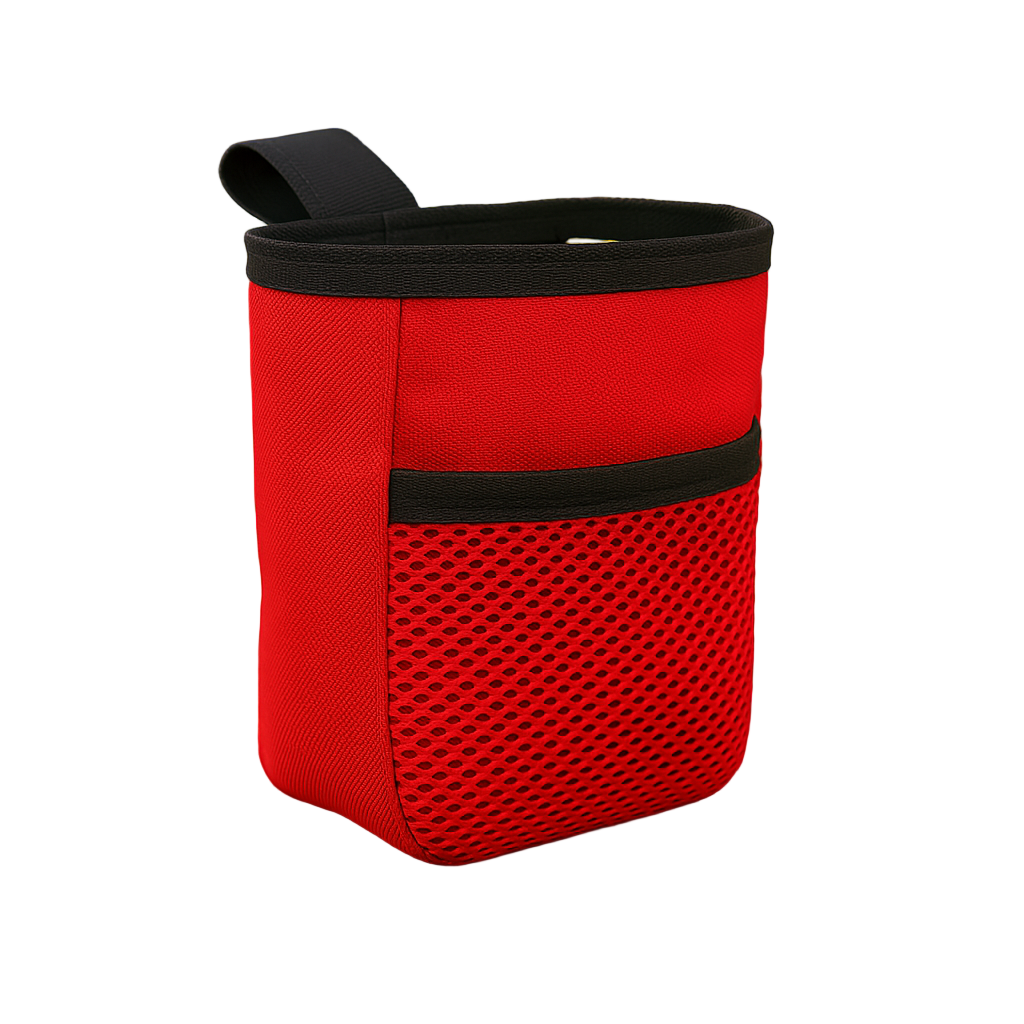 Red chalk bag with black accents on a wooden surface in a park setting