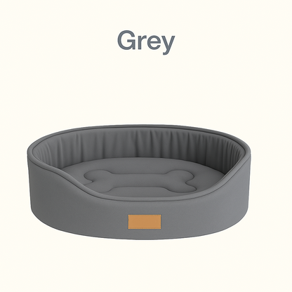 Gray pet bed with a bone-shaped indentation on a white background