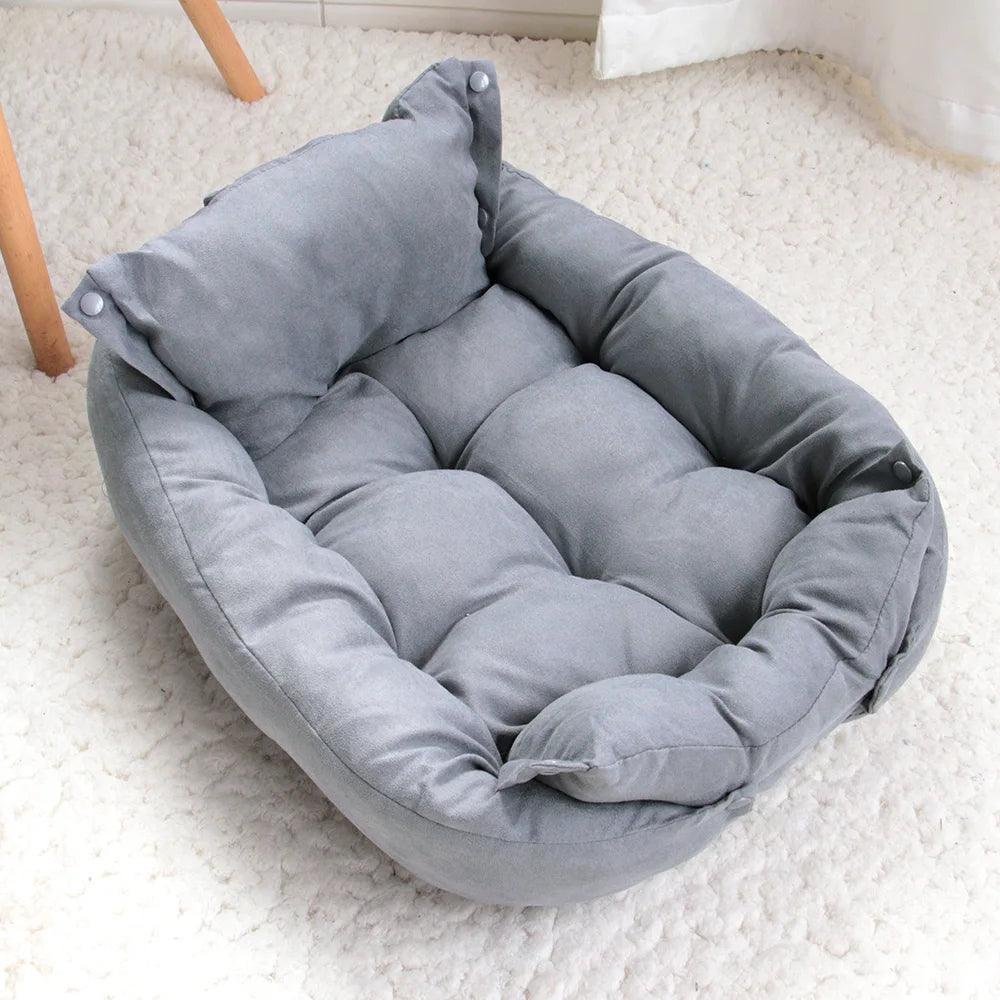 Gray pet bed on a white carpet