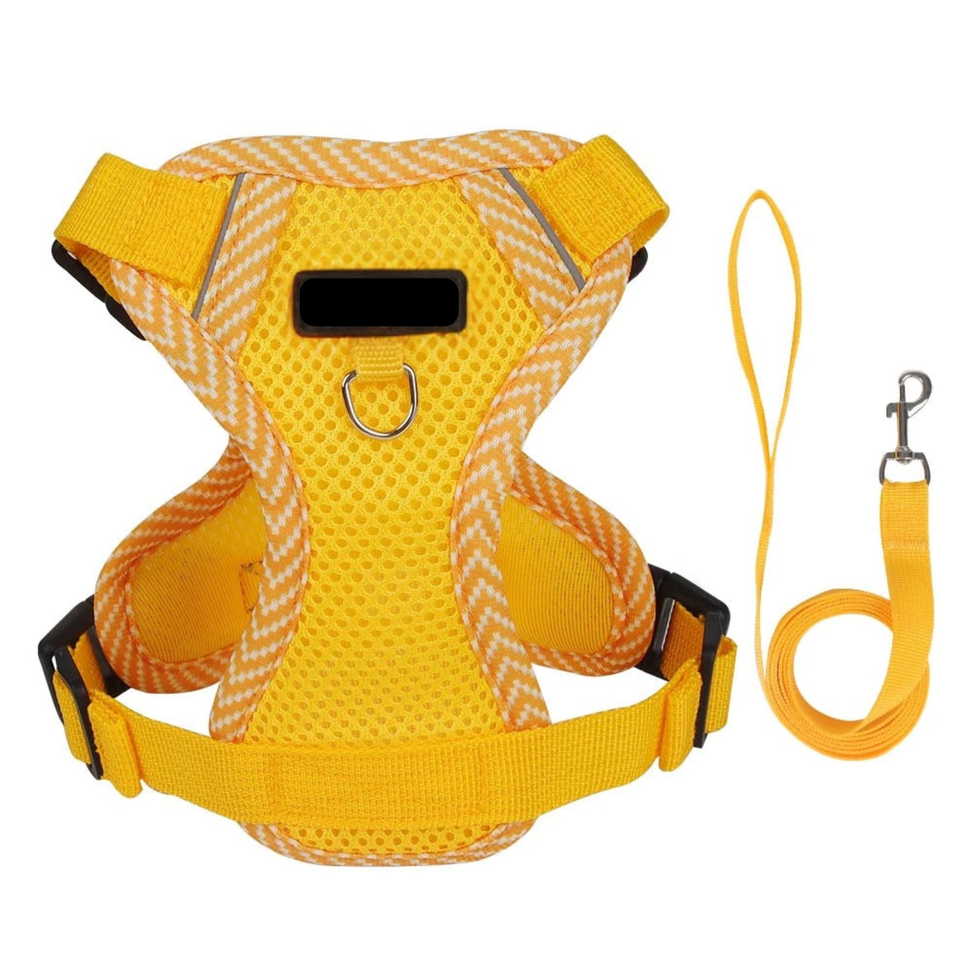 Yellow dog harness and leash set on a white background