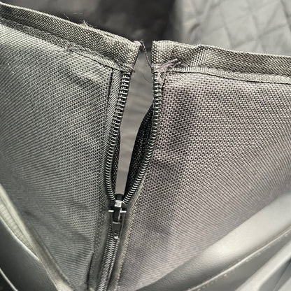 Close-up of a gray bag with a zipper