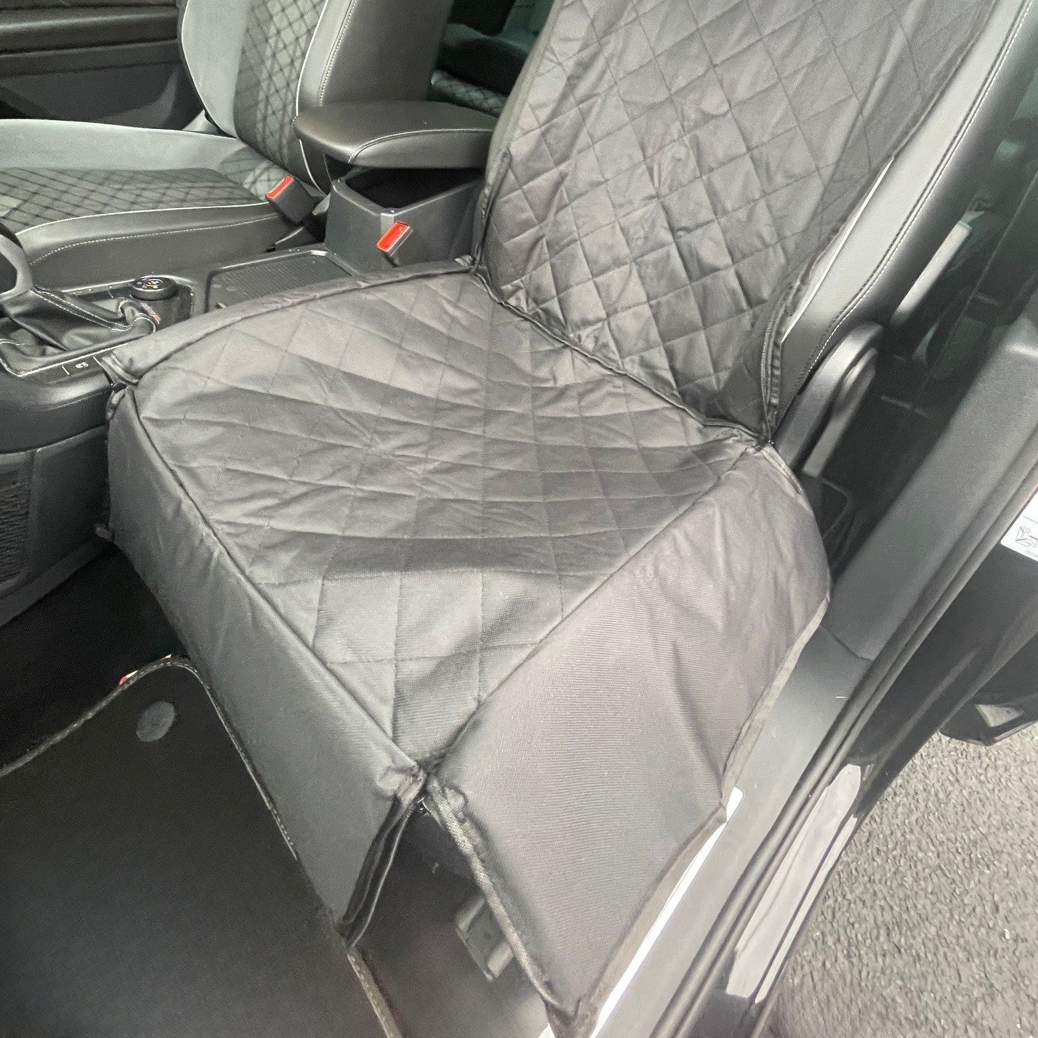 Car seat cover on a vehicle seat with quilted design