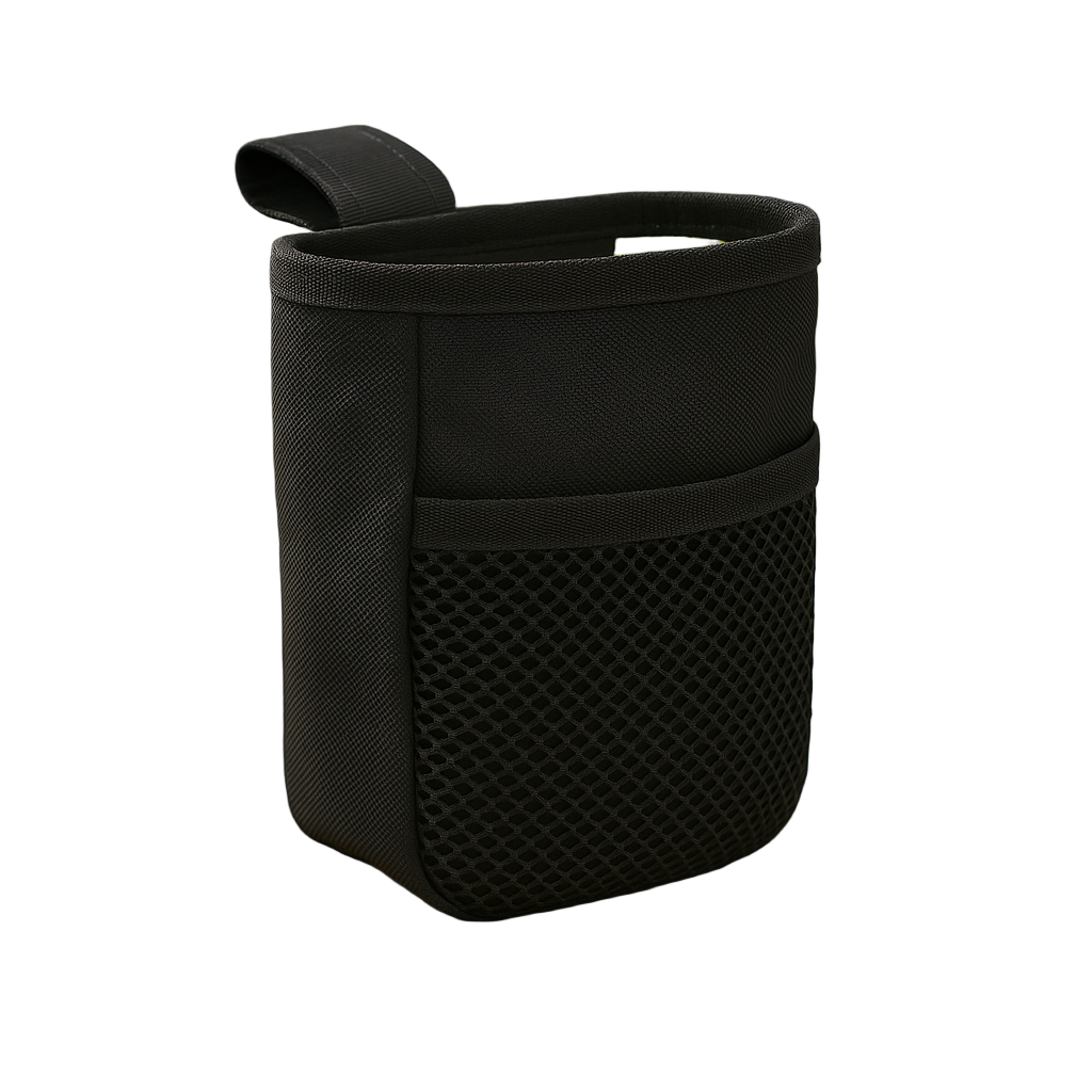 Black fabric pouch with mesh pocket on a wooden surface with a blurred green outdoor background